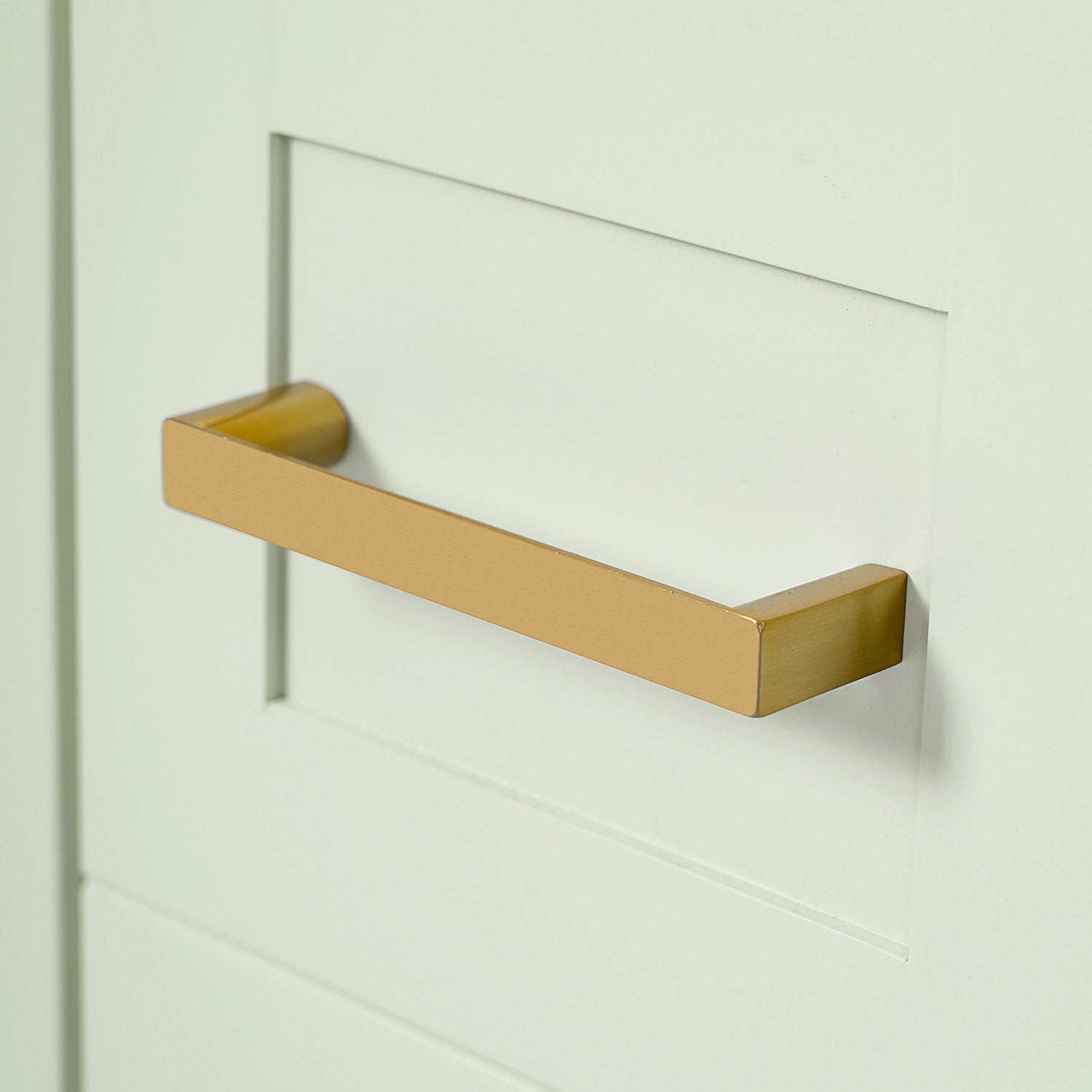 gold hardware on green bathroom cabinet