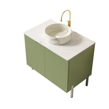 green bathroom cabinet with ivory vessel sink and Carrara look countertop