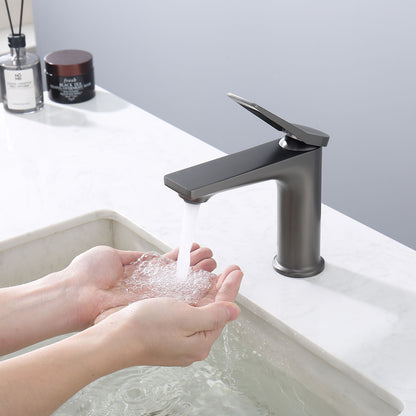 hand holding water from a Grey Single Hole Single Handle Bathroom Faucet