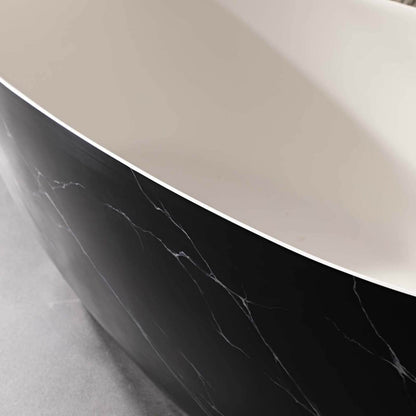 minimalist bathroom with black marble effect freestanding bathtub