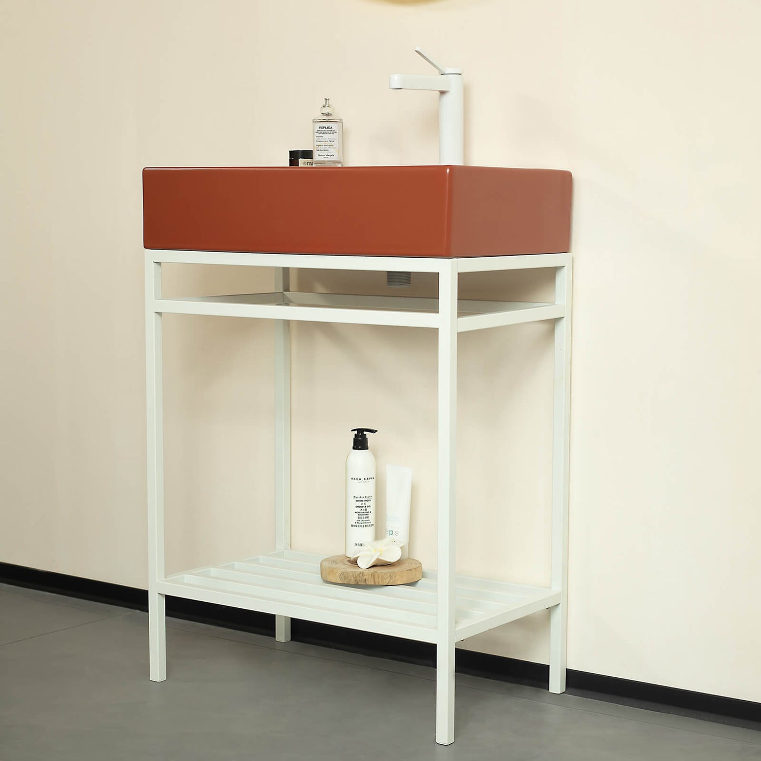 red ceramic bathroom sink with white metal frame