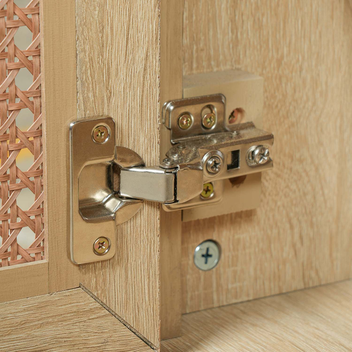 soft close concealed cabinet door hinge detail on woven rattan bathroom vanity door