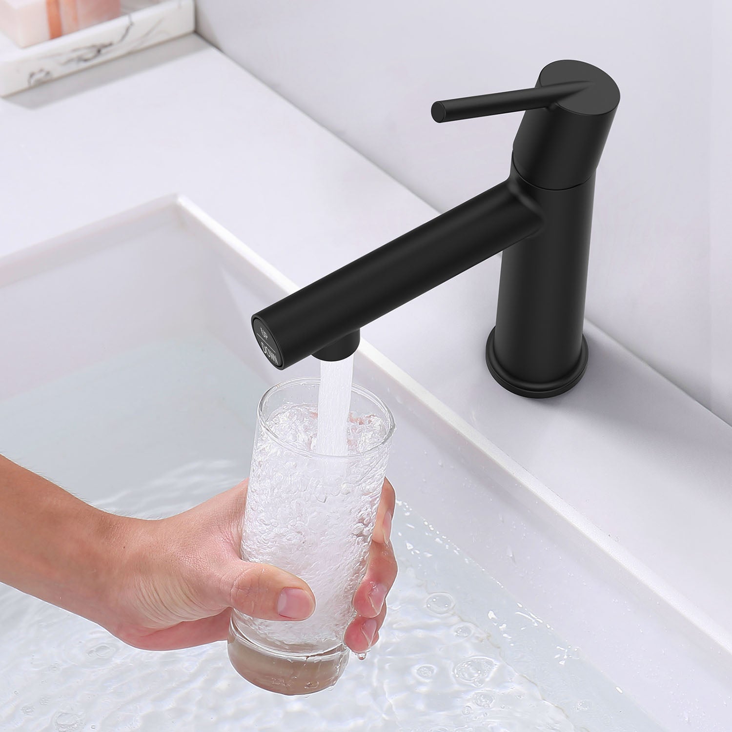 take a glass of water from Matte Black Single Handle Bathroom faucet