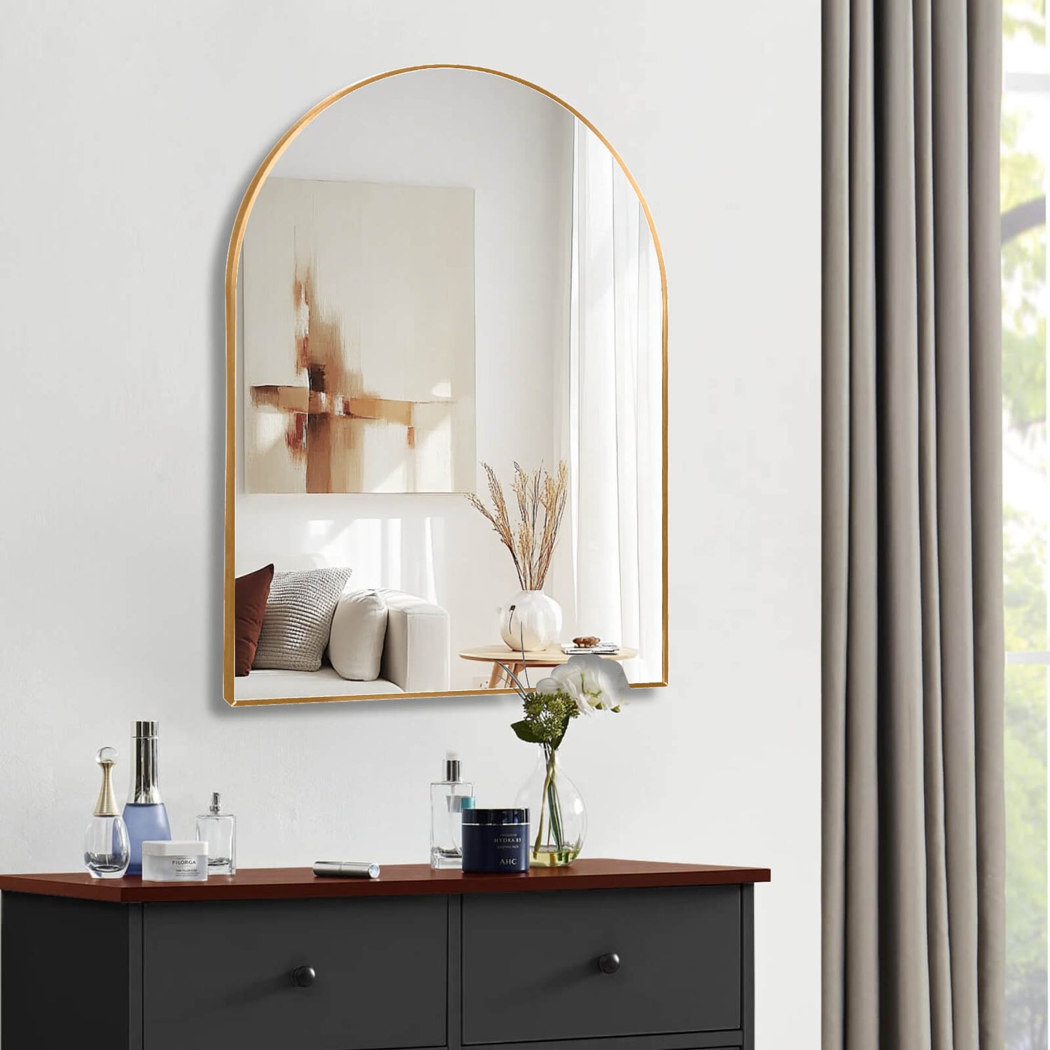 warm gold mirror reflecting bathroom light