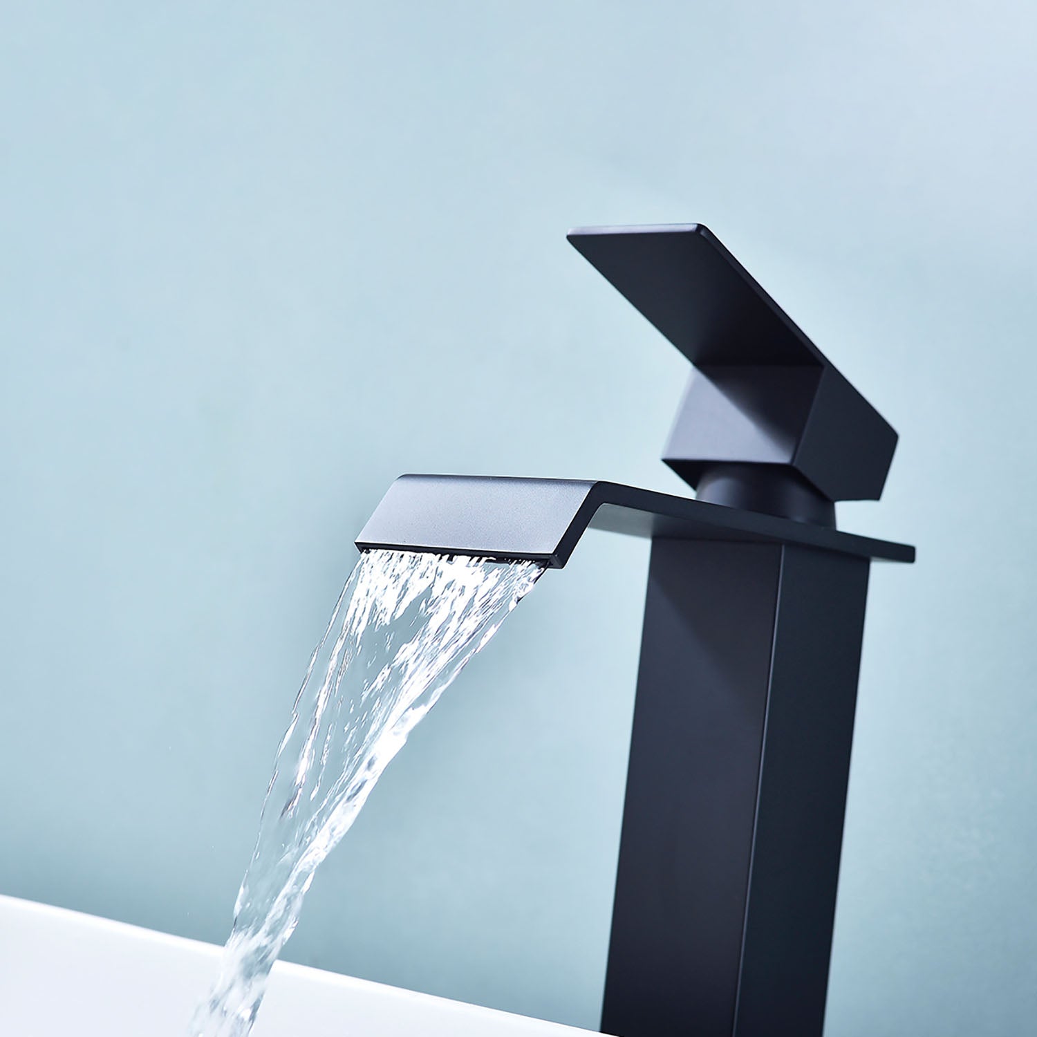 waterfall flow from Matte Black Single Handle Bathroom Faucet