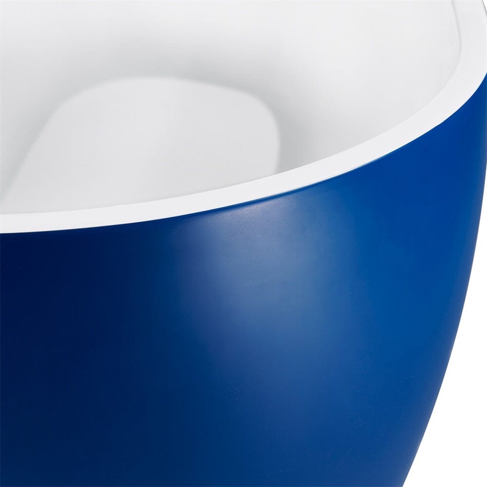 Enlarged view of edge of blue center drain freestanding soaking tub